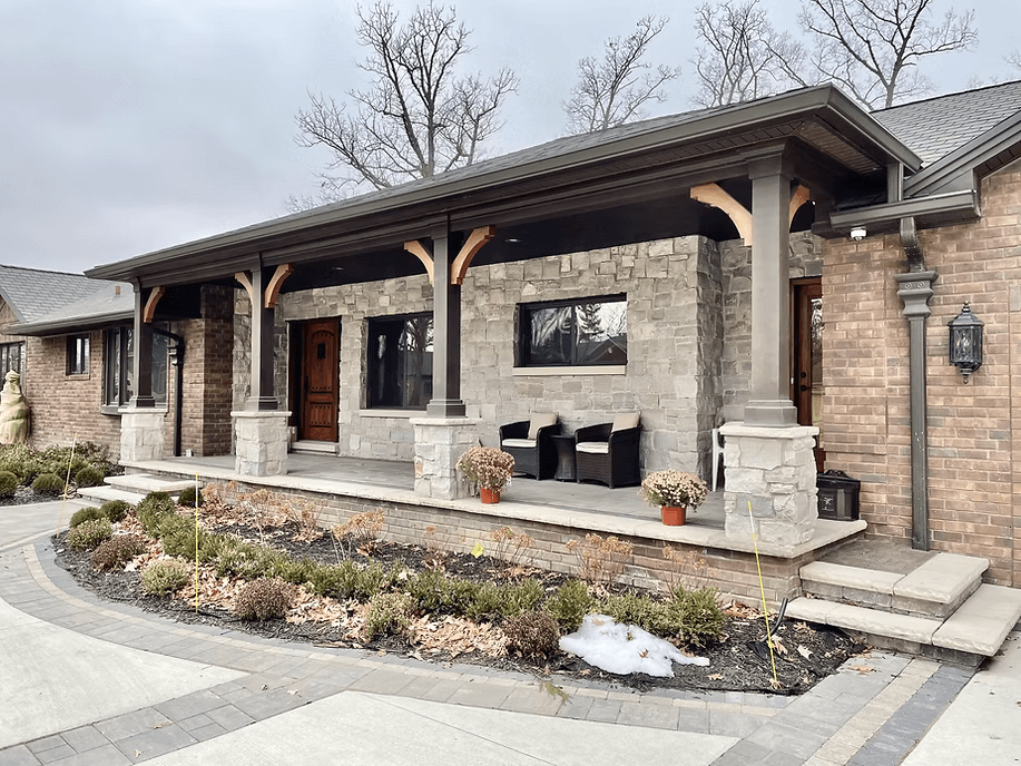 Beautiful stone and brick home exterior with covered porch